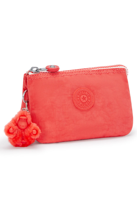 Kipling Creativity Small Purse. A small coral purse with zipper compartment, multiple inner compartments, Kipling logo, and monkey charm.