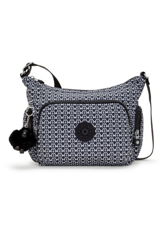 Kipling Gabb S Medium Crossbody Bag. A crossbody bag with adjustable strap, zip closure, multiple compartments, Kipling monkey charm, and all over black and white print.