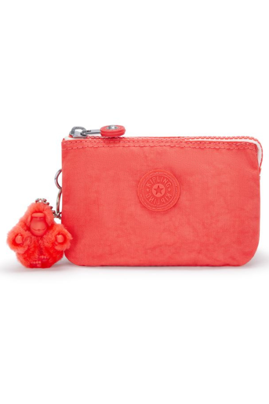 Kipling Creativity Small Purse. A small coral purse with zipper compartment, multiple inner compartments, Kipling logo, and monkey charm.