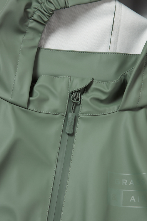 An image of the Grass & Air Puddle Suit in Khaki.