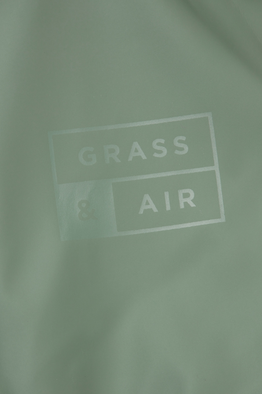 An image of the Grass & Air Puddle Suit in Khaki.