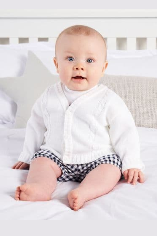 An image of the Dandelion Knitted Cardigan in White.