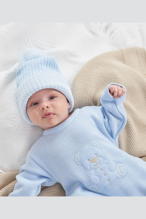 An image of the Dandelion Teddy Bear Knitted Onesie in Blue.