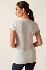 An image of a female model wearing the Ariat Saddle T-Shirt in the colour Heather Grey.