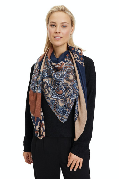 An image of a female model wearing the Betty Barclay Animal Print Scarf in the colour Dark Blue/Camel.