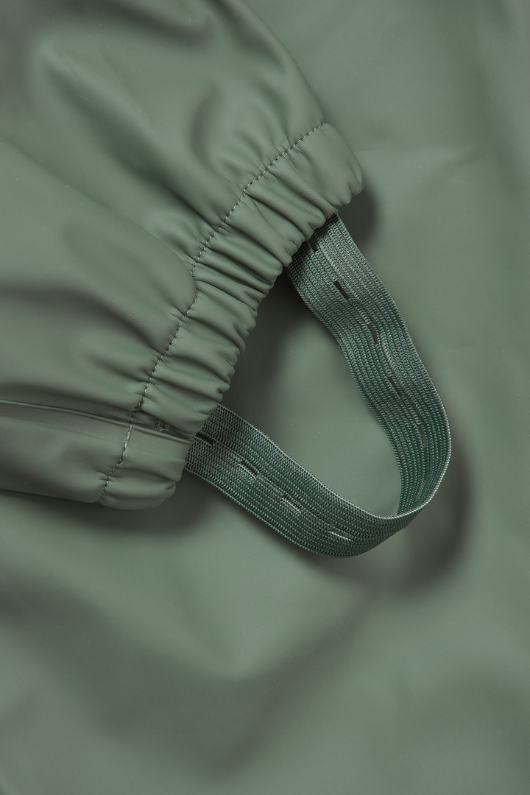 An image of the Grass & Air Puddle Suit in Khaki.