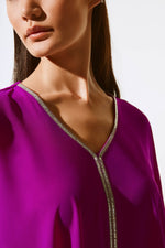 An image of a model wearing the Joseph Ribkoff Poncho Top in Empress.