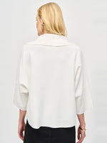 An image of a model wearing the Joseph Ribkoff Knit Top in Vanilla.