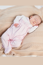 An image of the Dandelion Bunny & Flower Smocked Sleepsuit in Pink.