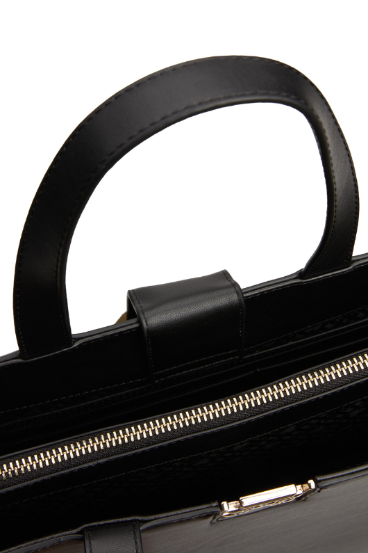 An image of the Tommy Hilfiger TH Monogram Removable Strap Satchel in Black.