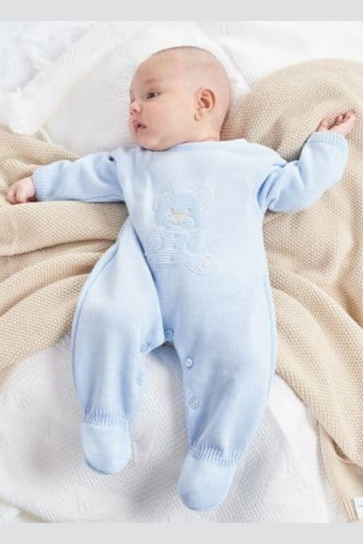 An image of the Dandelion Teddy Bear Knitted Onesie in Blue.