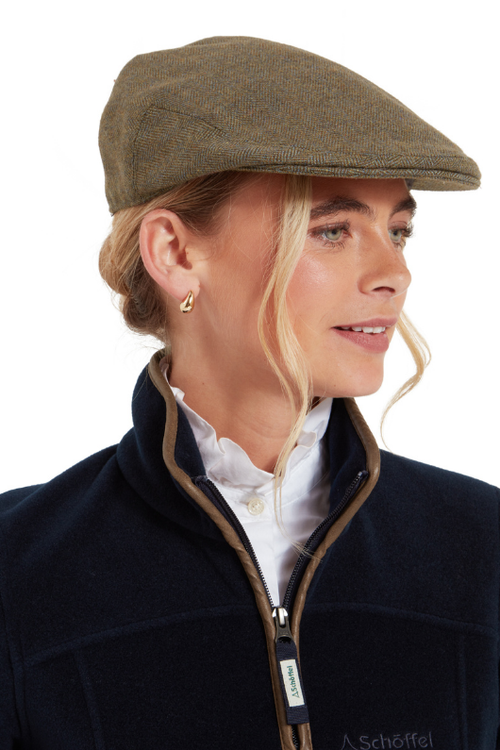 An image of the Schoffel Ladies Tweed Cap in Loden Green Herringbone.