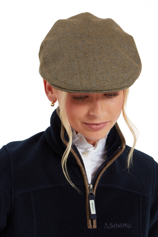 An image of the Schoffel Ladies Tweed Cap in Loden Green Herringbone.