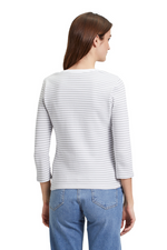 An image of a female model wearing the Betty Barclay Striped Short T-Shirt Jacket in the colour Grey White.