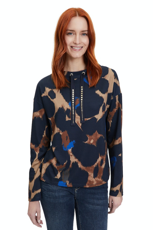 An image of a female model wearing the Betty Barclay Animal Print Sweatshirt in the colour Dark Blue/Camel.