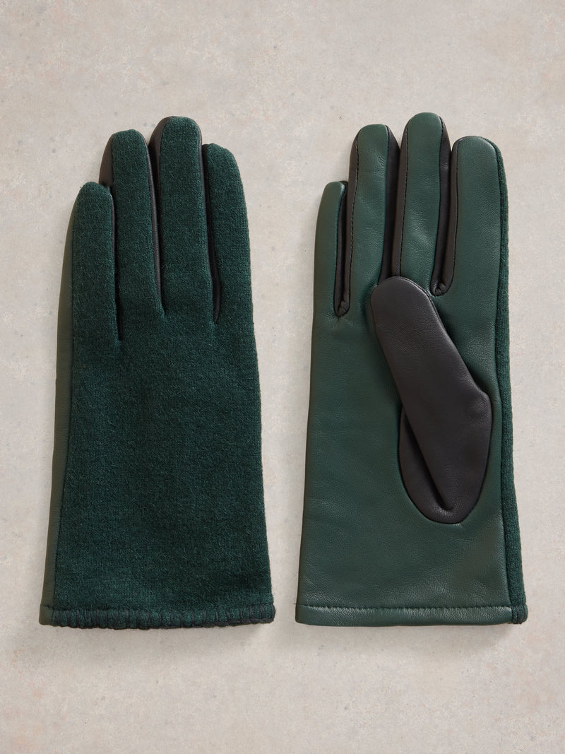 An image of the White Stuff Lucie Leather Gloves in Dark Green.