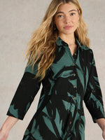 An image of the White Stuff Rua Jersey Shirt Dress in Green Print.