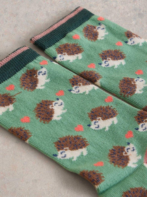 An image of the White Stuff Hedgehog Ankle Socks in Green Multi.