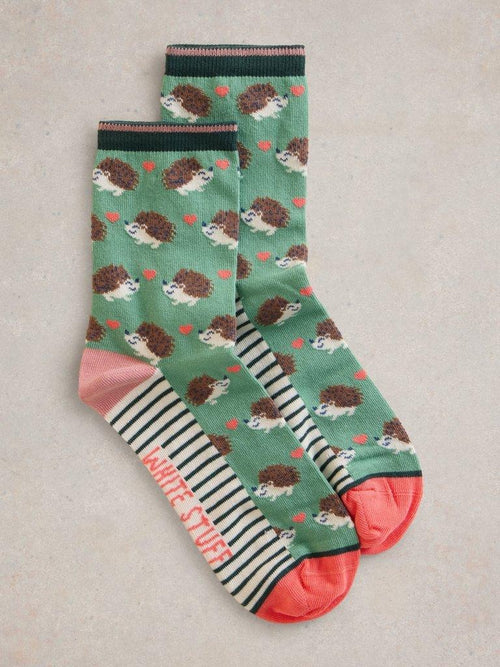 An image of the White Stuff Hedgehog Ankle Socks in Green Multi.