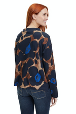 An image of a female model wearing the Betty Barclay Animal Print Sweatshirt in the colour Dark Blue/Camel.