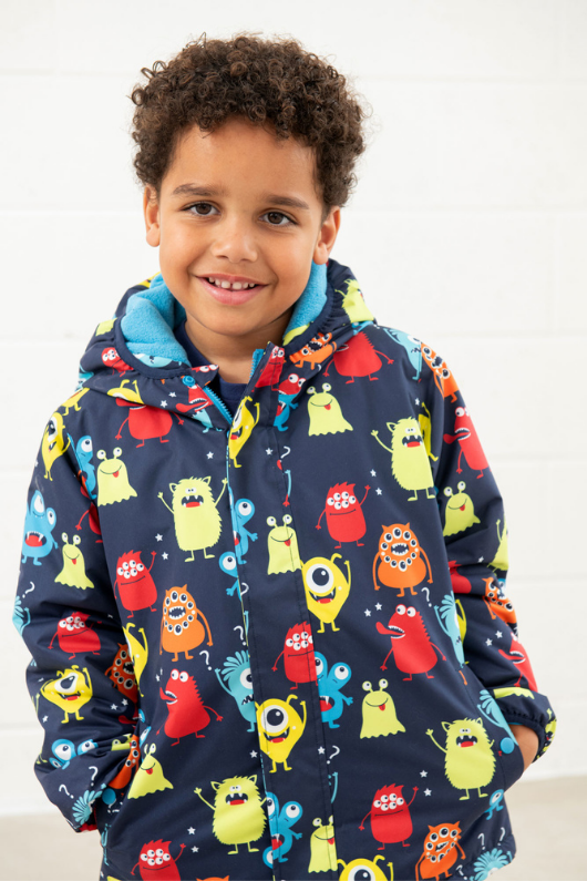 An image of the Lighthouse Finlay Boys Coat in Monster Print.