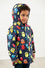 An image of the Lighthouse Finlay Boys Coat in Monster Print.