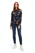 An image of a female model wearing the Betty Barclay Animal Print Sweatshirt in the colour Dark Blue/Camel.