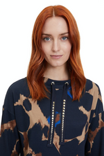 An image of a female model wearing the Betty Barclay Animal Print Sweatshirt in the colour Dark Blue/Camel.