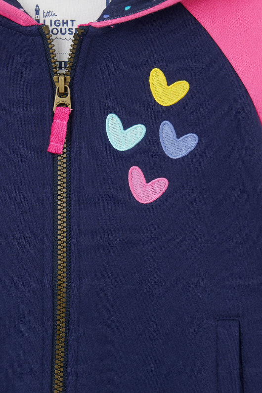 An image of the Lighthouse Jasmine Full Zip in Navy/Pink & Hearts.