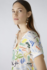 Oui Amalfi Print Top. A casual fit top with short sleeves, V-neck, jersey striped back, and Amalfi themed print on front.