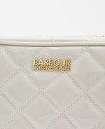 An image of the Barbour International Quilted Sloane Bag in Gloss Silver Birch.