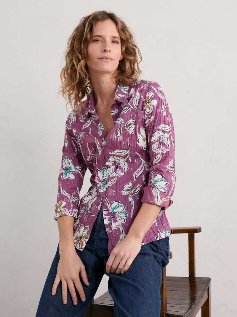 An image of a model wearing the Seasalt Larissa Shirt in the style Linework Floral Heather.