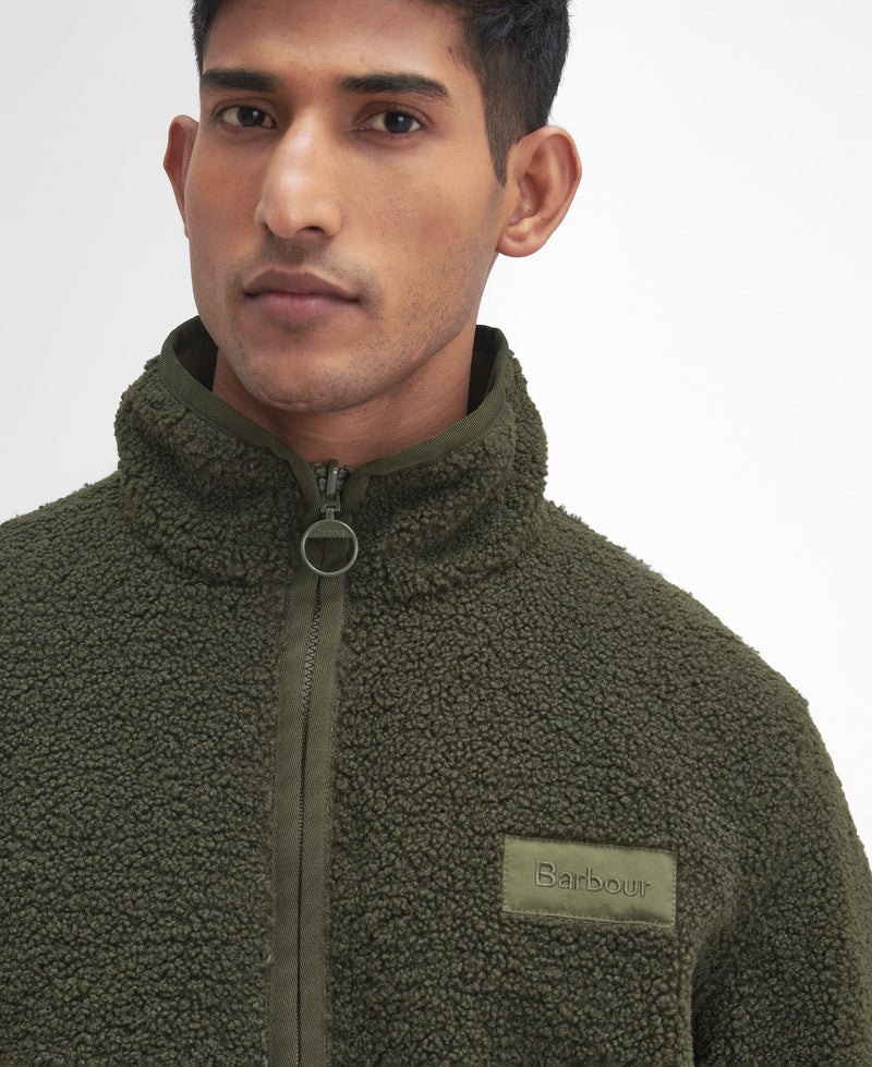 An image of the Barbour Reversible Fleece in Fern.