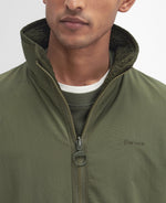 An image of the Barbour Reversible Fleece in Fern.