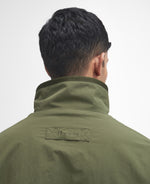 An image of the Barbour Reversible Fleece in Fern.