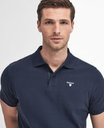 An image of the Barbour Tartan Pique Polo Shirt in Sapphire.