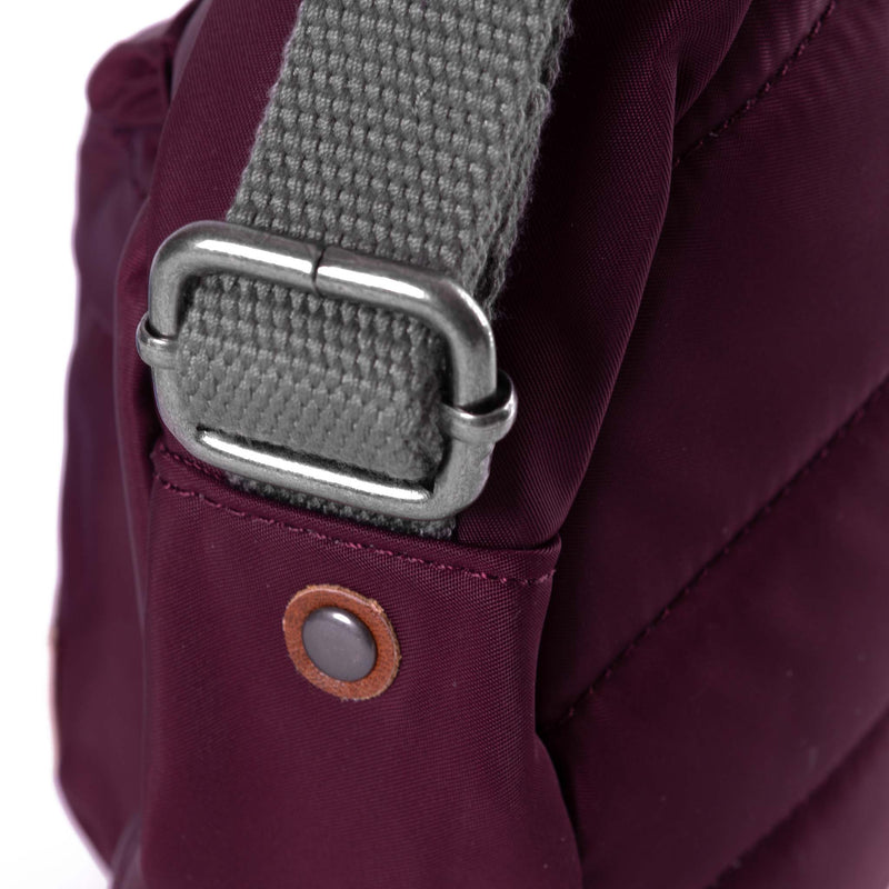 An Image of the ROKA Paddington B Crossbody in Plum.