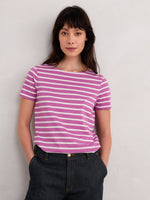 An image of a model wearing the Seasalt Sailor T-Shirt in the style Breton Viola Chalk.