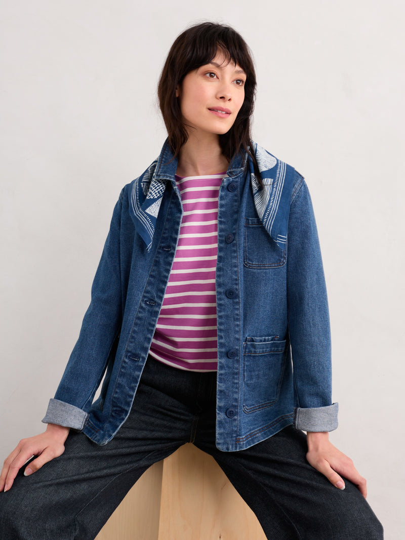 An image of a model wearing the Seasalt Sailor T-Shirt in the style Breton Viola Chalk.