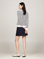 An image of a model wearing the Tommy Hilfiger Boat Neck Jersey Jumper in Ivory Petal/Desert Sky Stp.