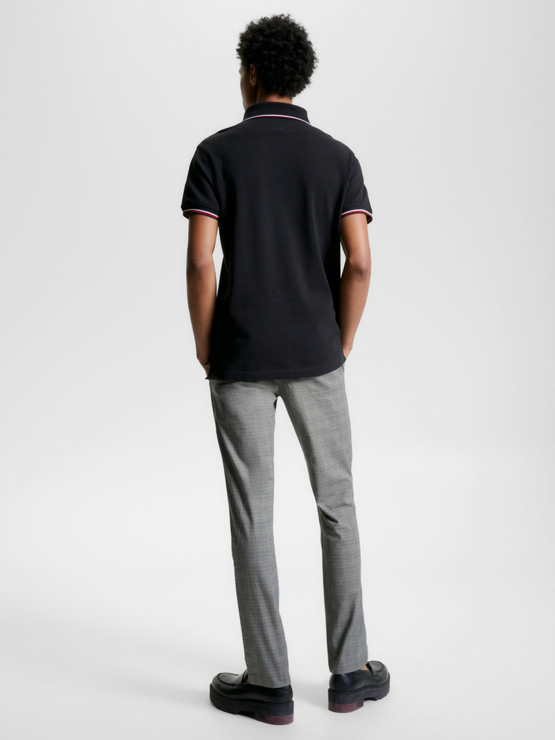 An image of the Tommy Hilfiger 1985 Collection Tipped Slim Fit Polo in the colour Black.