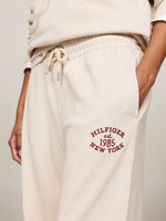 An image of the Tommy Hilfiger Varsity Logo Embroidery Joggers in Classic Beige.