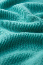 An image of the Seasalt Fruity Jumper in Seashore/Teal.