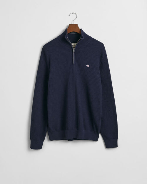 An image of the Gant Micro Textured Half Zip Sweater in Evening Blue.