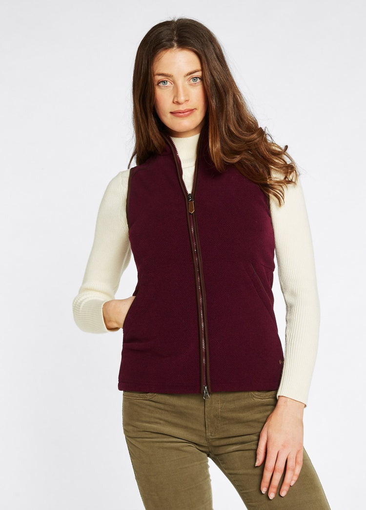 An image of the Dubarry Carbury Fleece Gilet in Ox Blood.