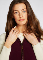 An image of the Dubarry Carbury Fleece Gilet in Ox Blood.