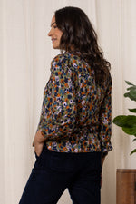 An image of the Lily & Me Braidstone Blouse Floral Ikat in Olive.